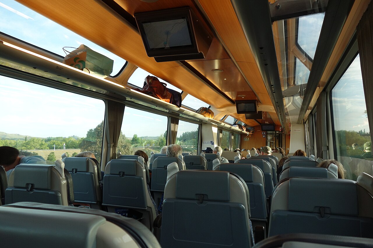 Coastal Pacific passenger seats beneath large panoramic windows