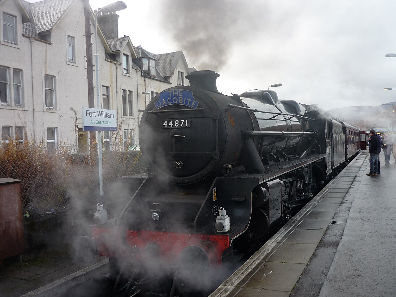 The Jacobite steam locomotive and carriages surrounded by steam at Fort William
