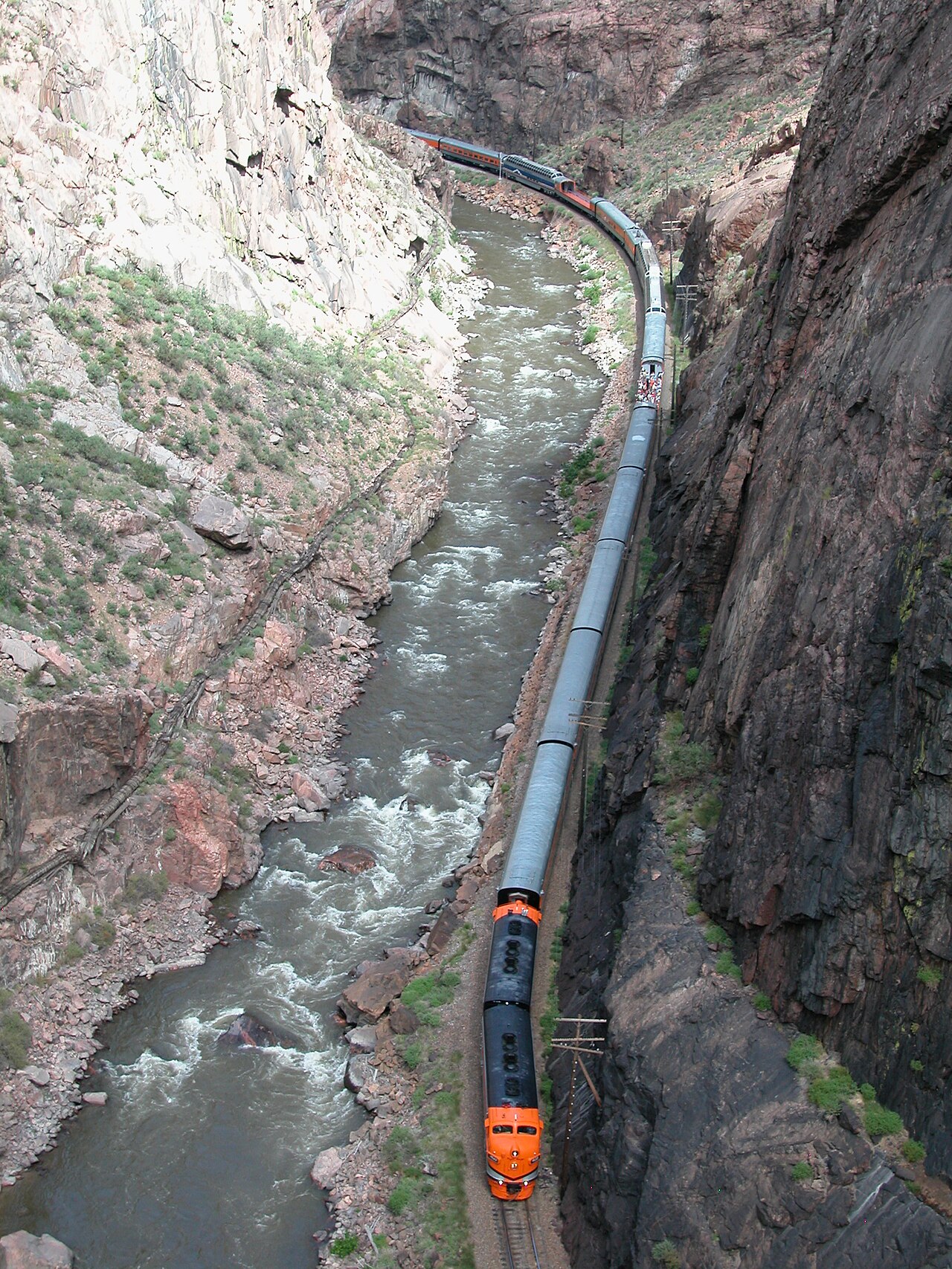 Royal Gorge Route train following the river between steep canyon walls
