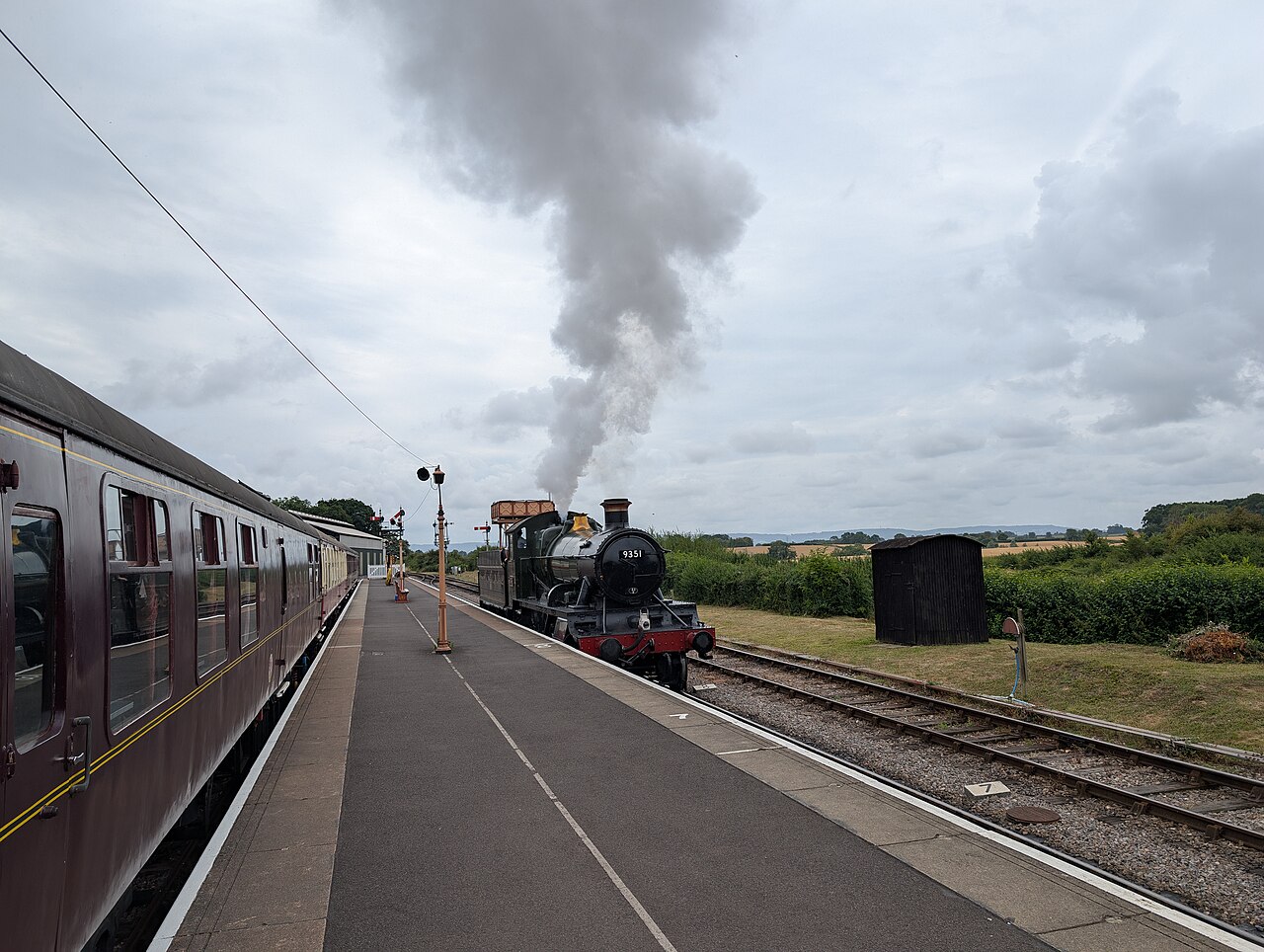 Steam locomotive and heritage passenger carriages at Bishops Lydeard station